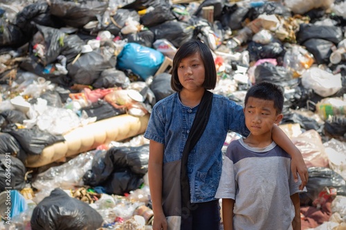 Children find junk for sale and recycle them in landfills, the lives and lifestyles of the poor, Child labor, Poverty and Environment Concepts