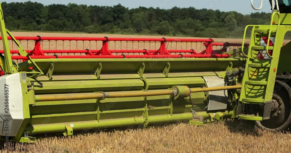 Combine Harvester. Reapers. Modern Combine Harvester At The Harvest Of Cereal. Prores, Slow Motion Combine Harvester. Reapers. Modern Combine Harvester At The Harvest Of Cereal. Prores, Slow Motion