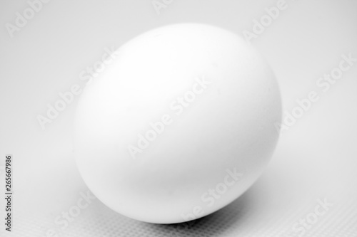 white egg on neutral background