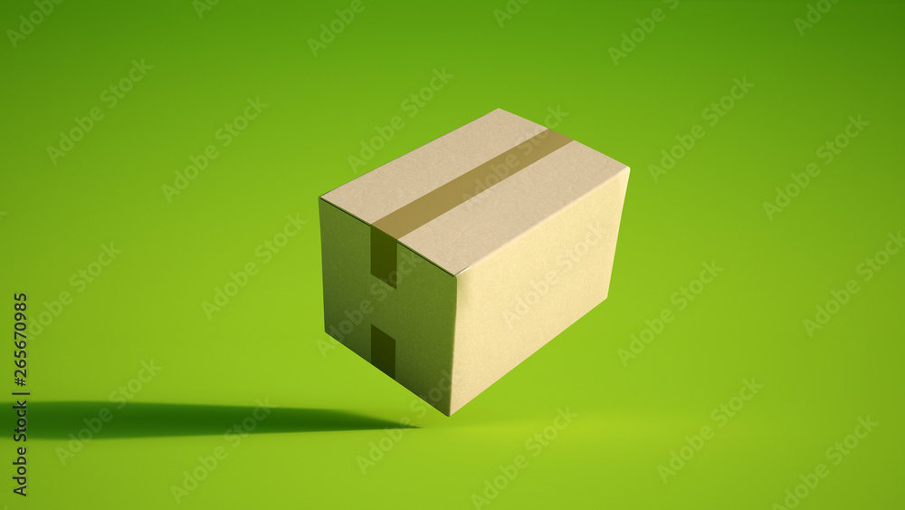 Obraz premium Cardboard box on green