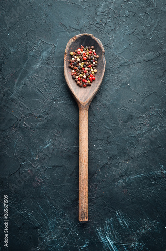 Pepper peas Spices on a black background. Top view. free space for your text.