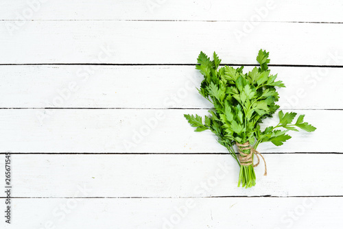 Fresh green parsley on the old background. Top view. free space for your text.