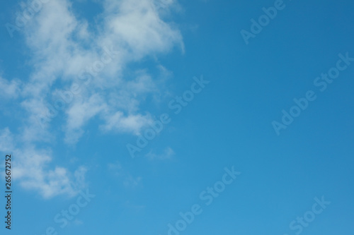 Beautiful white fluffy clouds on a light blue sky background. Wonderful skies