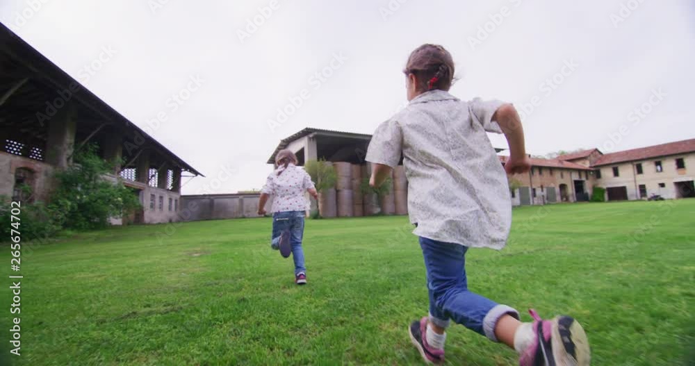 Authentic shot of cute little girl carefree running and having fun on a countryside background in a sunny spring day. Authentic shot of cute little girl carefree running and having fun on a countryside background in a sunny spring day.