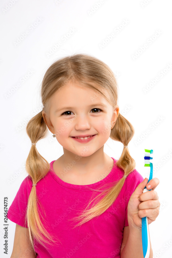 Happy little girl standing with toothbrush isolated on white.little child brush his teeth.Cute little girl is brushing teeth with a smile.dental hygiene. happy little girl brushing her tooth Happy little girl standing with toothbrush isolated on white.little child brush his teeth.Cute little girl is brushing teeth with a smile.dental hygiene. happy little girl brushing her tooth