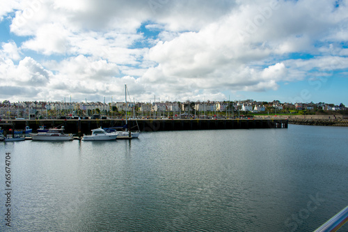 Yachts  and motorboats docked at marina in Bangor. Sailboat Harbor against blue sky © Maciej