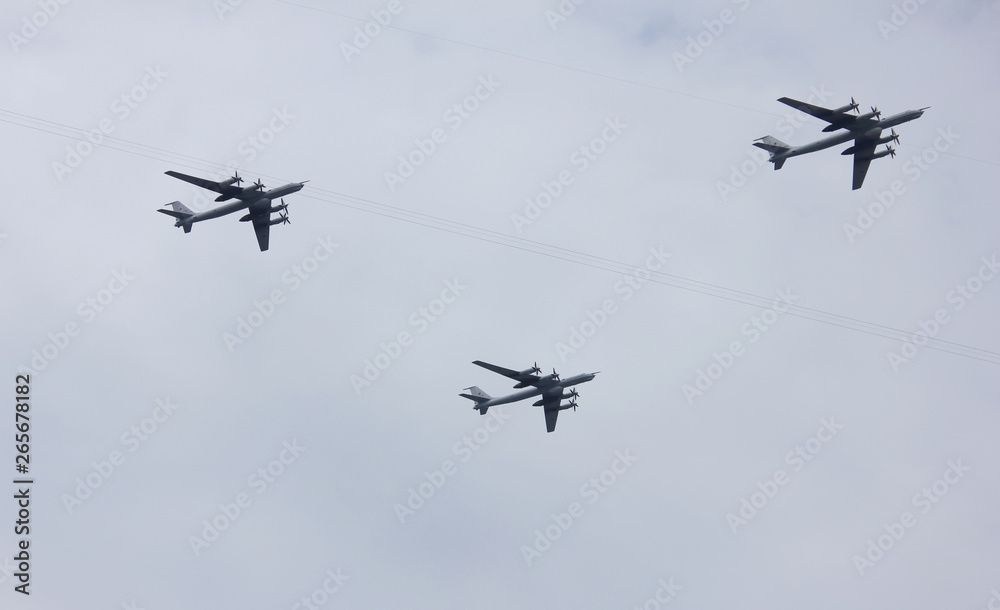 Armed fighter jet planes of Russian military aviation flying on empty sky background in St. Petersburg, Russia Armed fighter jet planes of Russian military aviation flying on empty sky background in St. Petersburg, Russia