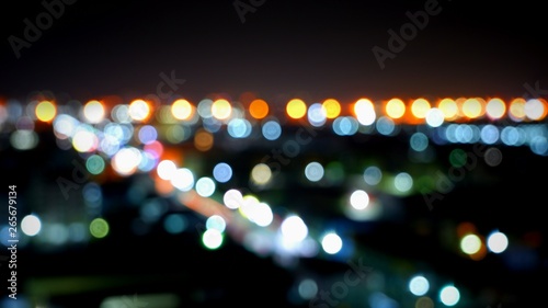 Abstract blurred background of colorful night light city with highway in landscape view for background decorations concept © Prapat