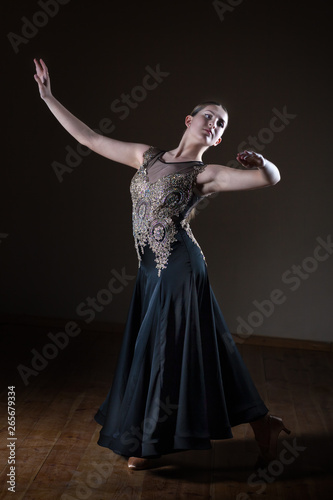 Beautiful dancer girl in ballroom isolated on black background