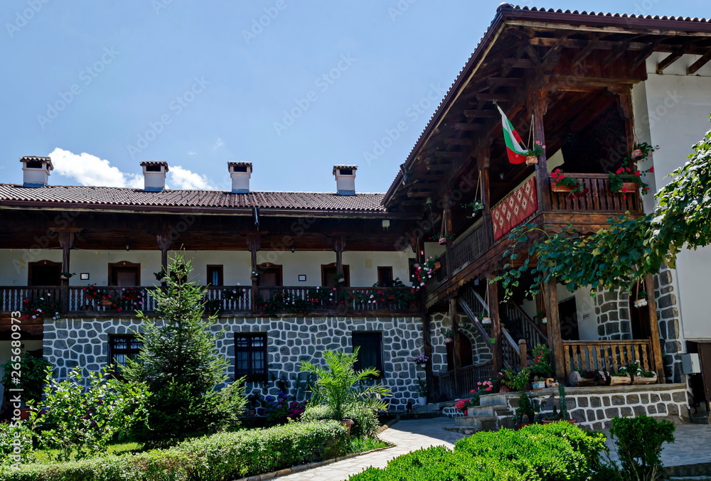 Part of exterior ancient monastic house in Klisura Monastery St. Cyril and St. Methodius, founded in the 12th century, mountain Balkan, near Varshets town, Bulgaria, Europe 