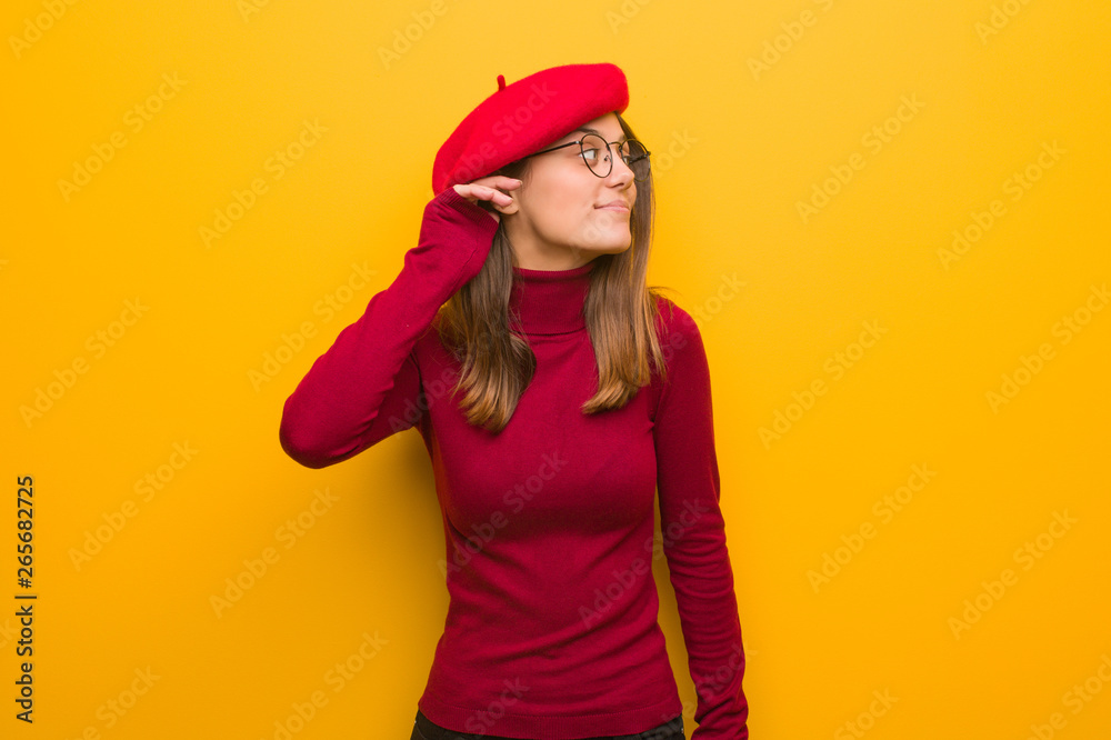 Young french artist woman try to listening a gossip