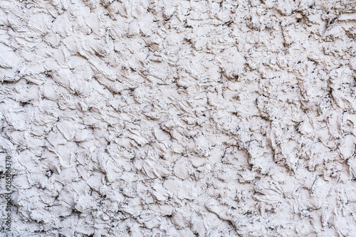 gray texture of a concrete wall, layer of decorative plaster, abstract background