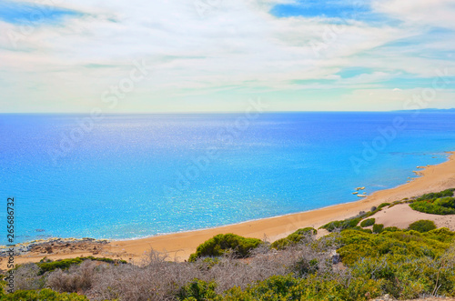 Beautiful empty beach in Turkish Northern Cyprus taken against sun. The remote place is Golden Beach in Karpas Peninsula. Summer vacation destination