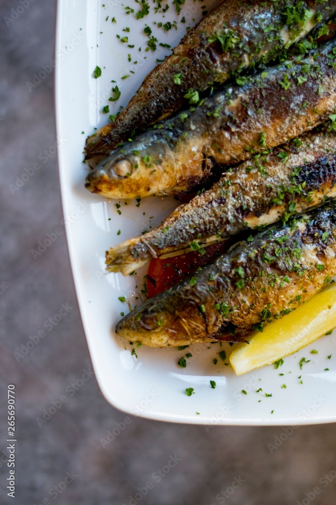 Sardines on a plate with romesco salsa 2 Sardines on a plate with romesco salsa 2