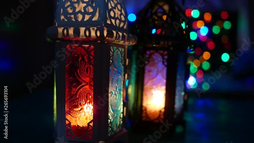 Close up low light studio set up shot of lighted lantern - showing ramadan kareem or eid mubarak celebration conceptual. photo