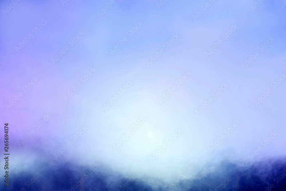 Abstraction. Background or texture in blue and light blue tones. Blurred image. Smoke-filled space. Abstraction. Background or texture in blue and light blue tones. Blurred image. Smoke-filled space.