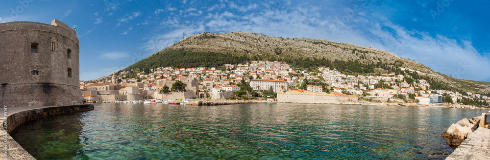Mediterranean panorama of the beautiful Dubrovnik old city including the old port, city walls and fortifications