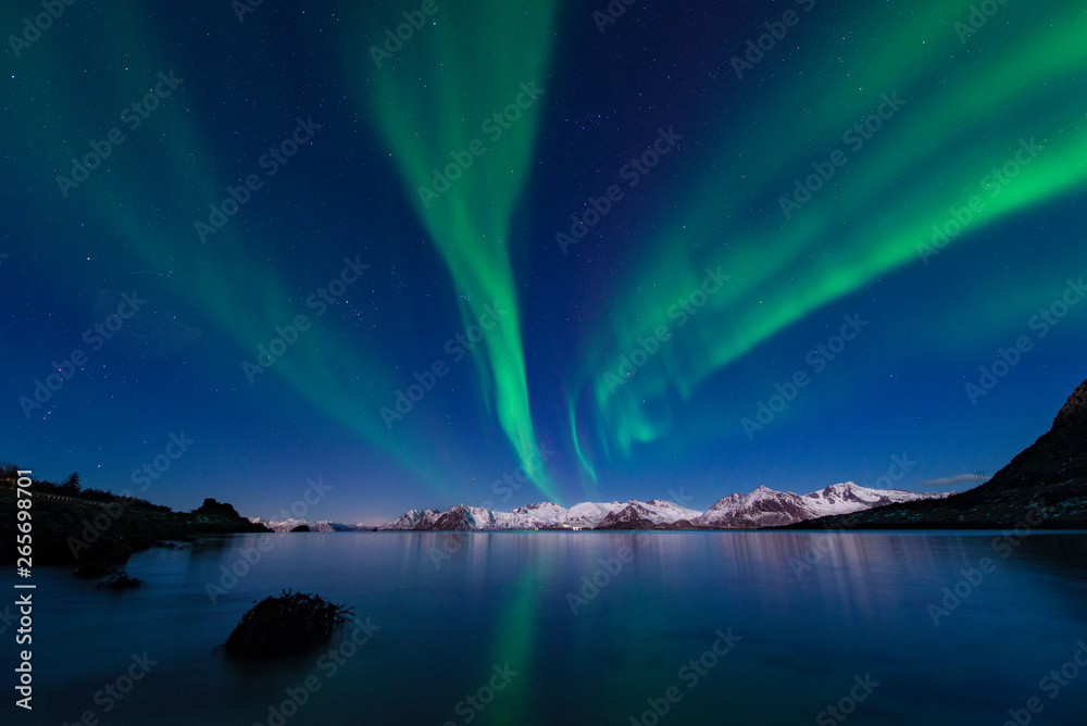 Green aurora borealis northern lights water reflection