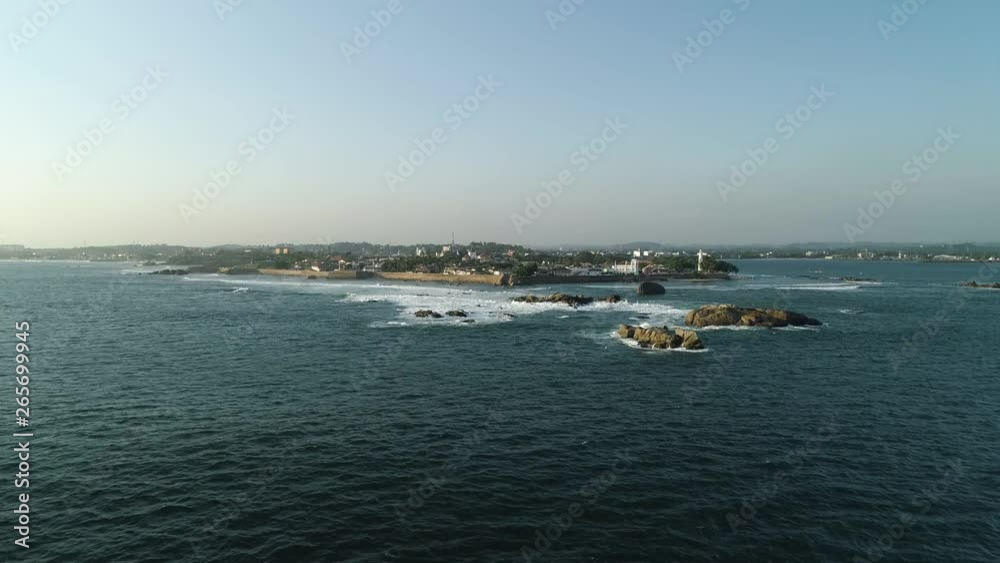 Flying towards Galle Fort, old Dutch fort in Sri Lanka over the ocean as sunsets Flying towards Galle Fort, old Dutch fort in Sri Lanka over the ocean as sunsets