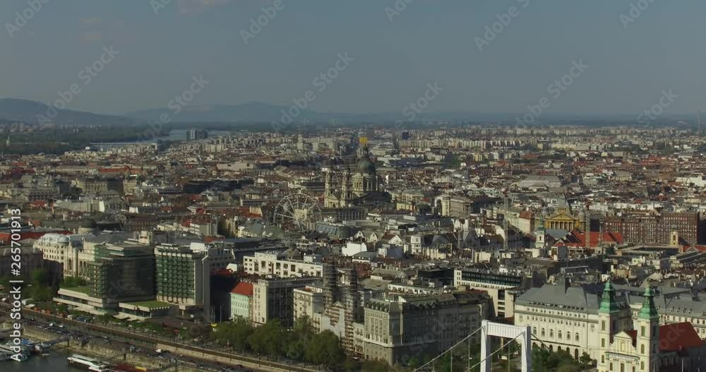 St. Stephen's Basilica and ferris wheel in the heart of the Budapest at daytime. St. Stephen's Basilica and ferris wheel in the heart of the Budapest at daytime.