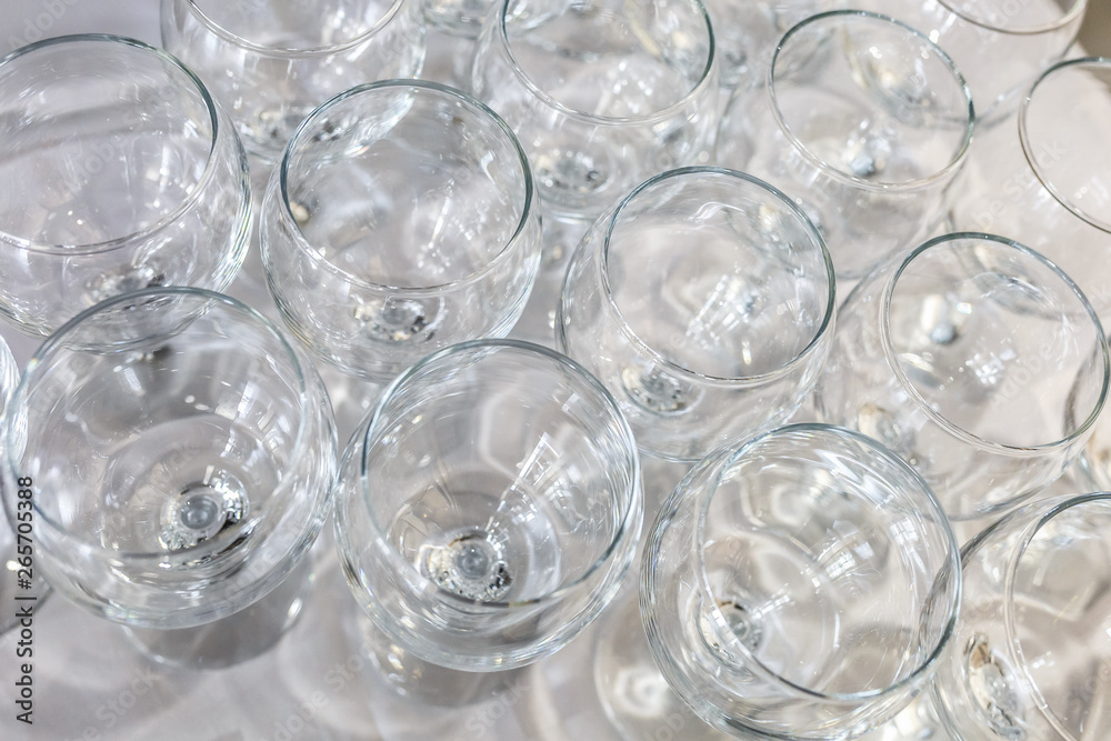 lot of blurred empty glasses on reception party table lot of blurred empty glasses on reception party table