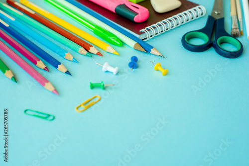 School supplies on blue background. Close up. Copy space.