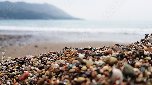 multicolored wet little beach rocks