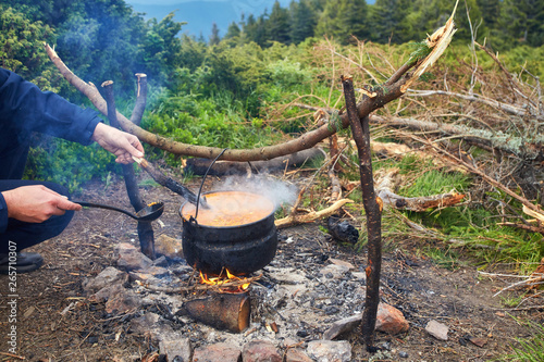 Preparing food on campfire in camping