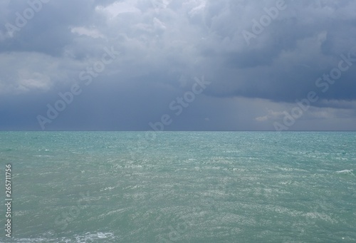 thunderclouds over waves of Mediterranean Sea. Belek. Turkey