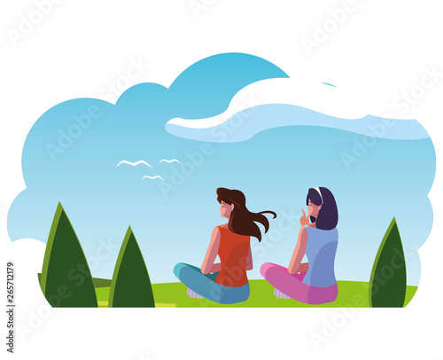 women couple contemplating the horizon in the field scene