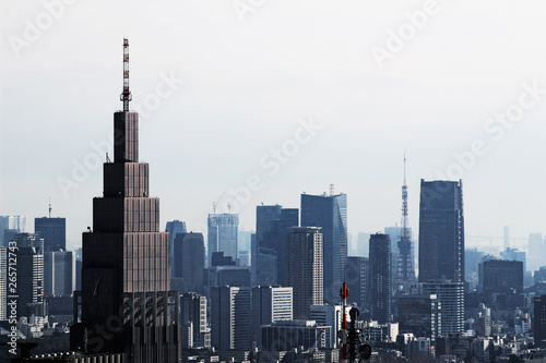 A view of Tokyo with a cell phone radio tower and various buildings