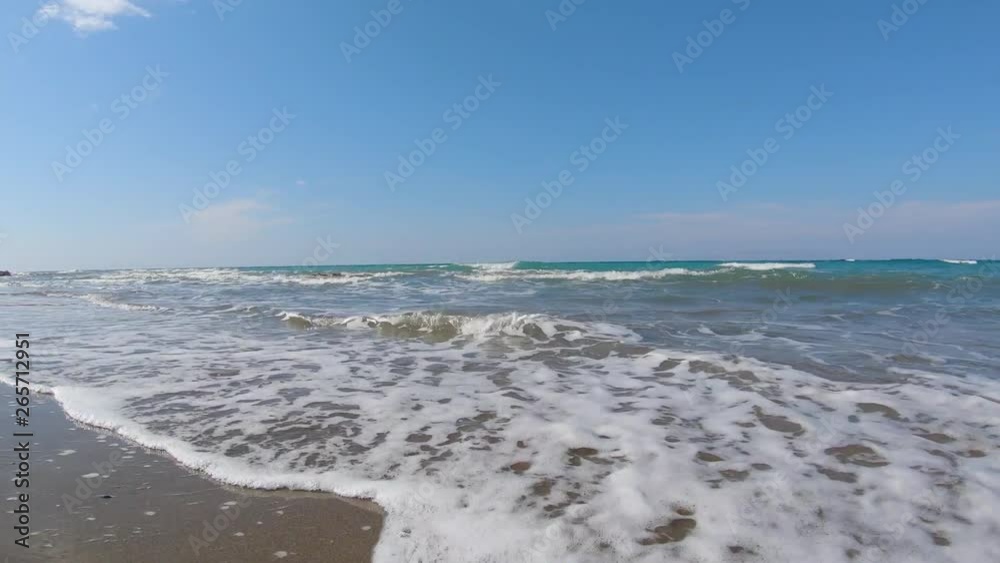 Watching the waves of the Mediterranean Sea at the beautiful island of Rhodes Greece Watching the waves of the Mediterranean Sea at the beautiful island of Rhodes Greece