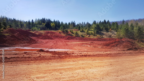 red ground landscape bauxite mineral aluminium ore near mine in Milici Bosnia and Herzegovina  photo