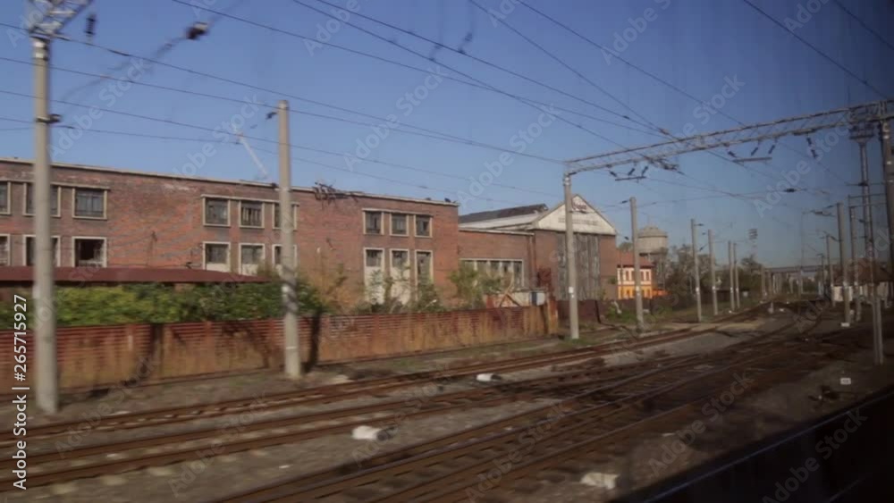 Slowly moving train going down tracks and looking out window at old run down industrial building, Slowly moving train going down tracks and looking out window at old run down industrial building,