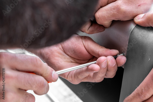 Human hand using screwdriver