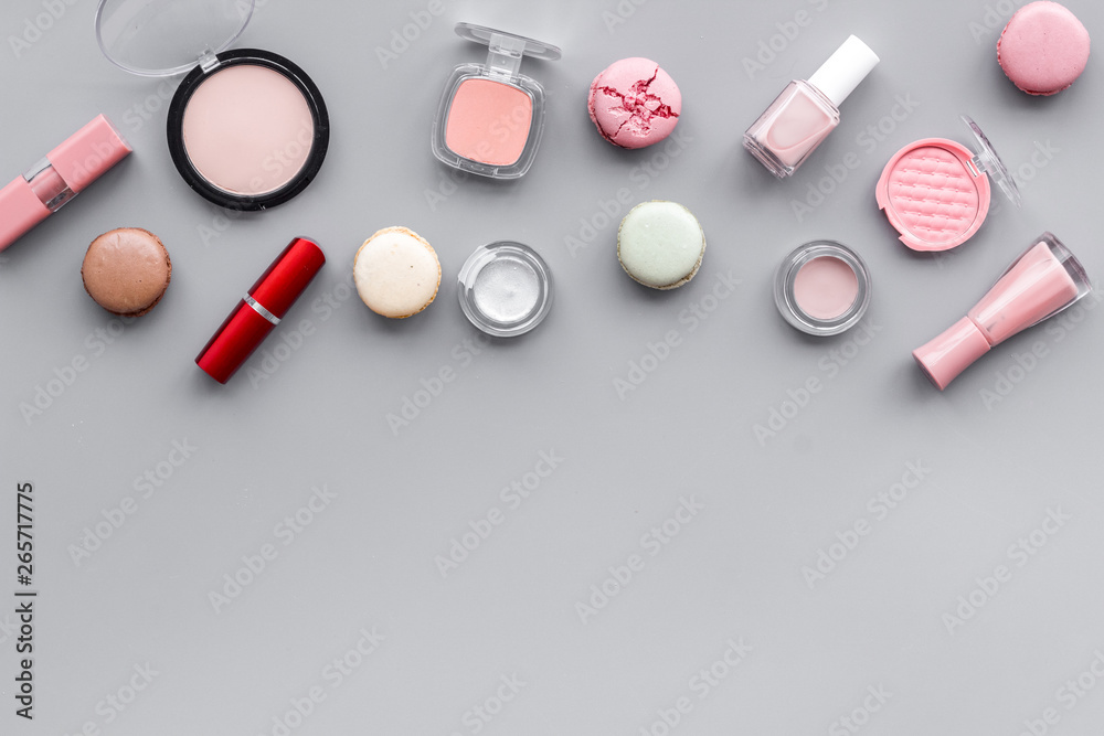 make-up accessories, fashion stylish cosmetics and macaroon on gray desk background top view copy space make-up accessories, fashion stylish cosmetics and macaroon on gray desk background top view copy space
