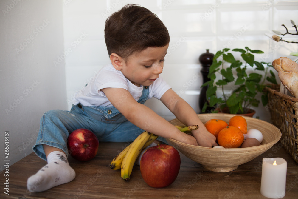 Fototapeta premium Kid having a table full of organic food. 