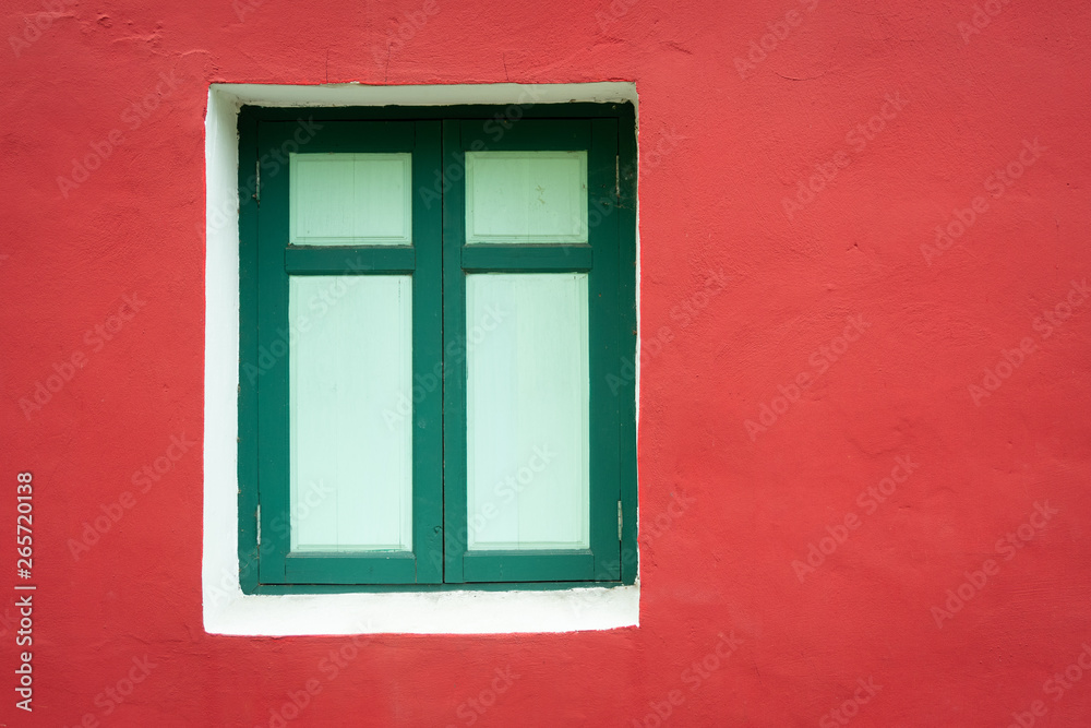 Green window frame with red cement wall vintage style.
