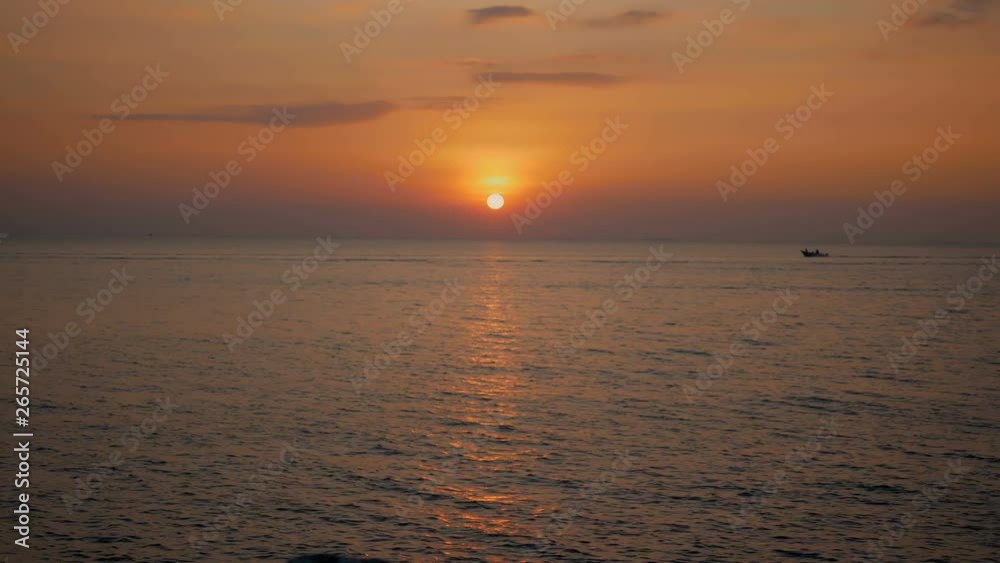 Small boat sailing on the sea with the sunset Small boat sailing on the sea with the sunset