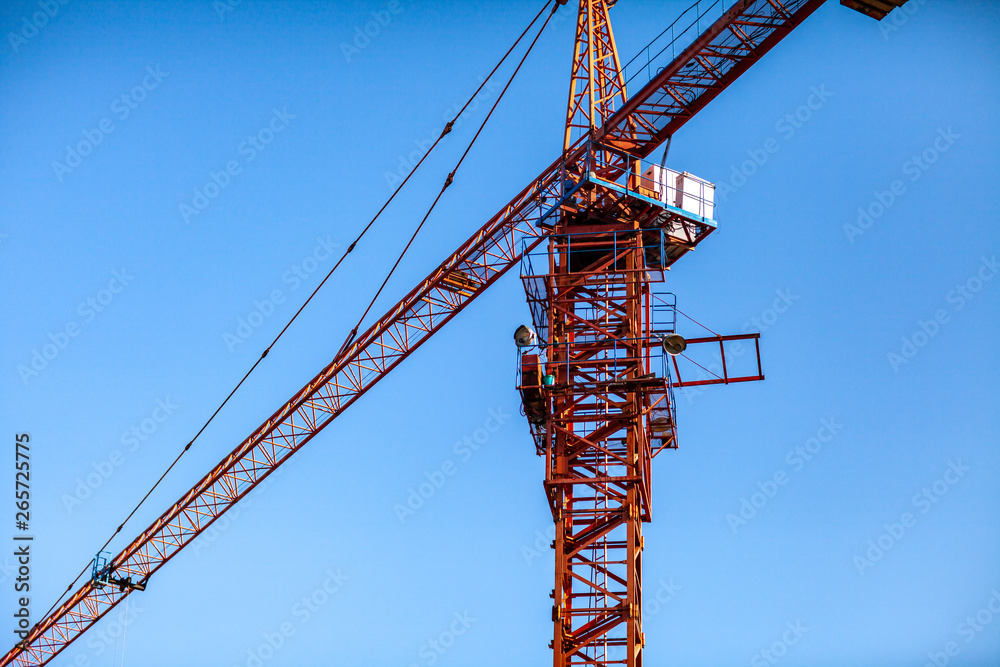 Construction crane tower on blue sky background. Construction crane tower on blue sky background.