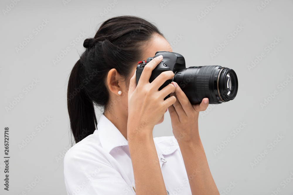 University Student Photographer hold camera with point to shoot subject, wear normal suit jacket. studio lighting gray background copy space, reporter journalist take photo celebrity University Student Photographer hold camera with point to shoot subject, wear normal suit jacket. studio lighting gray background copy space, reporter journalist take photo celebrity