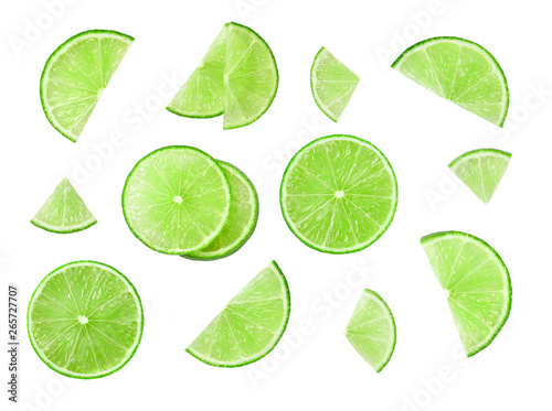 Fresh juicy lime slices isolated on white background.