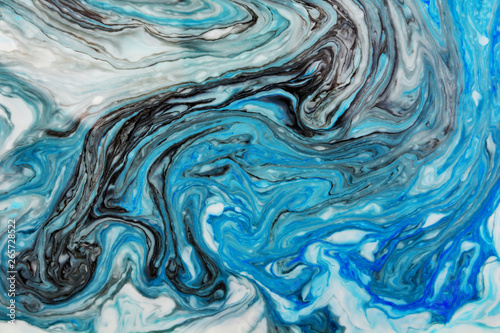 Abstract beautiful blue marble pattern with black color.The Eastern style of Ebru painting on water with acrylic paints swirls.A stylish mix of colors,natural luxury.