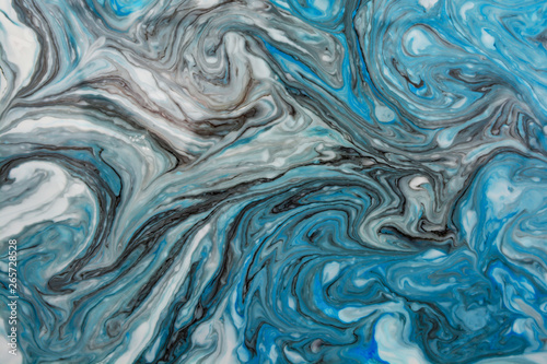 Abstract beautiful blue marble pattern with black color.The Eastern style of Ebru painting on water with acrylic paints swirls.A stylish mix of colors,natural luxury. © Ольга Васильева