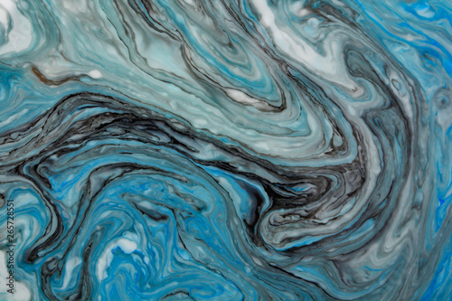 Abstract beautiful blue marble pattern with black color.The Eastern style of Ebru painting on water with acrylic paints swirls.A stylish mix of colors,natural luxury. © Ольга Васильева