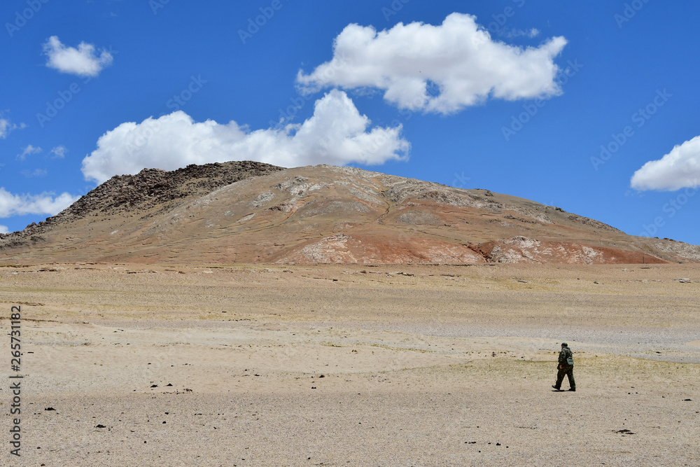 Tibet, China. Tourist on the shore of lake Gomang Tibet, China. Tourist on the shore of lake Gomang