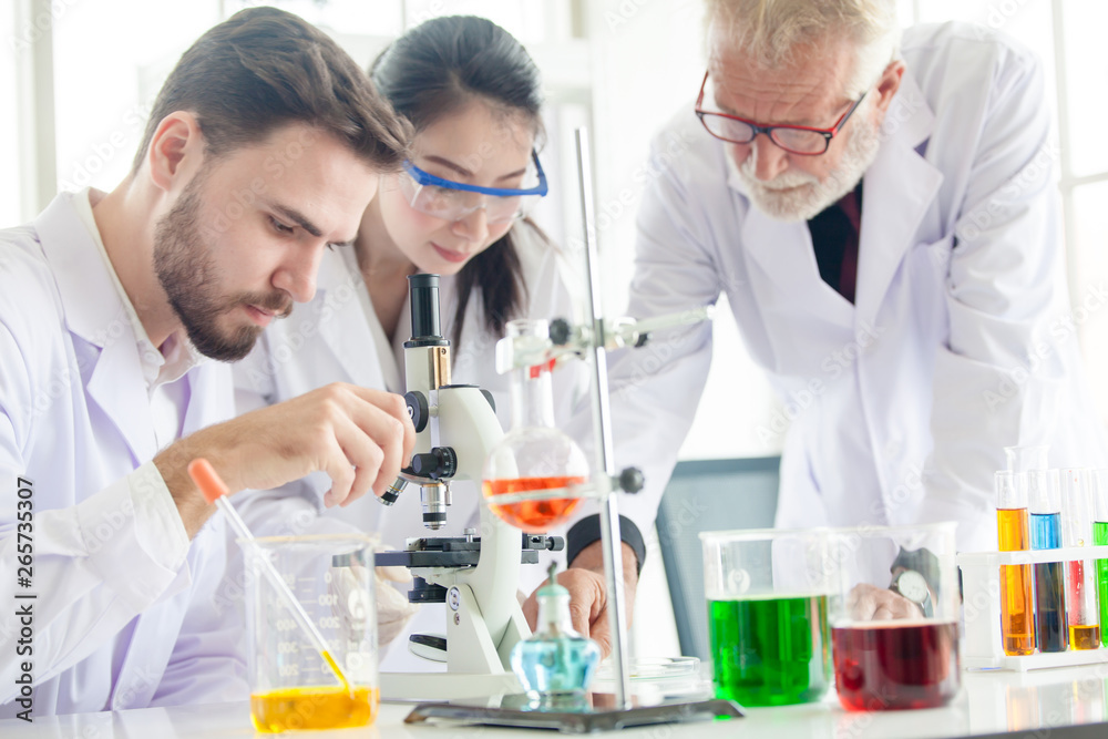 scientists conducting research in a lab environment. science laboratory research and development concept scientists conducting research in a lab environment. science laboratory research and development concept