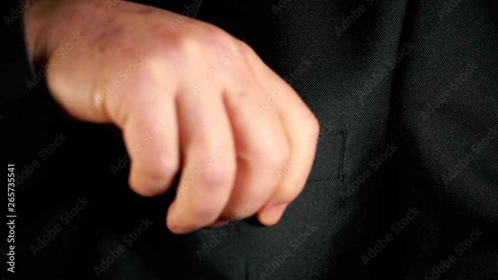 a man puts bitcoin in his pocket a man puts bitcoin in his pocket