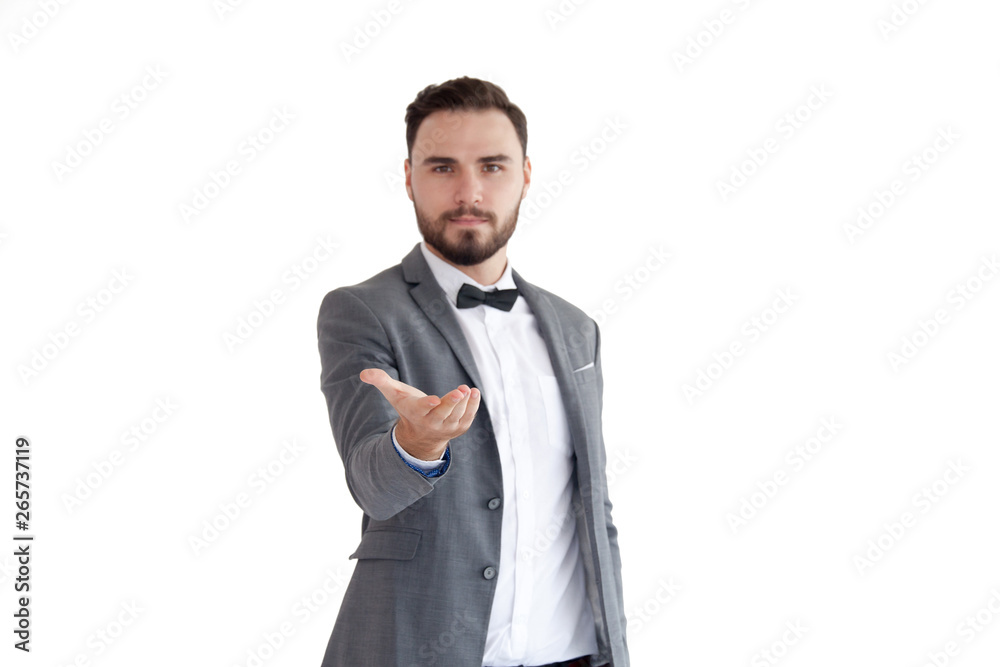 Man is standing and shows outstretched hand with open palm. Businessman hand touching virtual screen Man is standing and shows outstretched hand with open palm. Businessman hand touching virtual screen