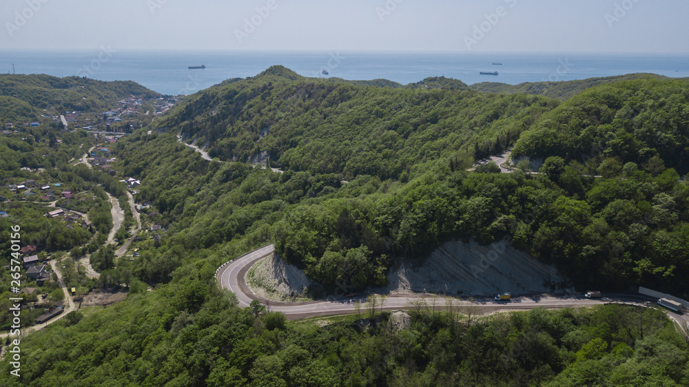 Aerial view of a curved winding road to Sochi Russia trough the mountains